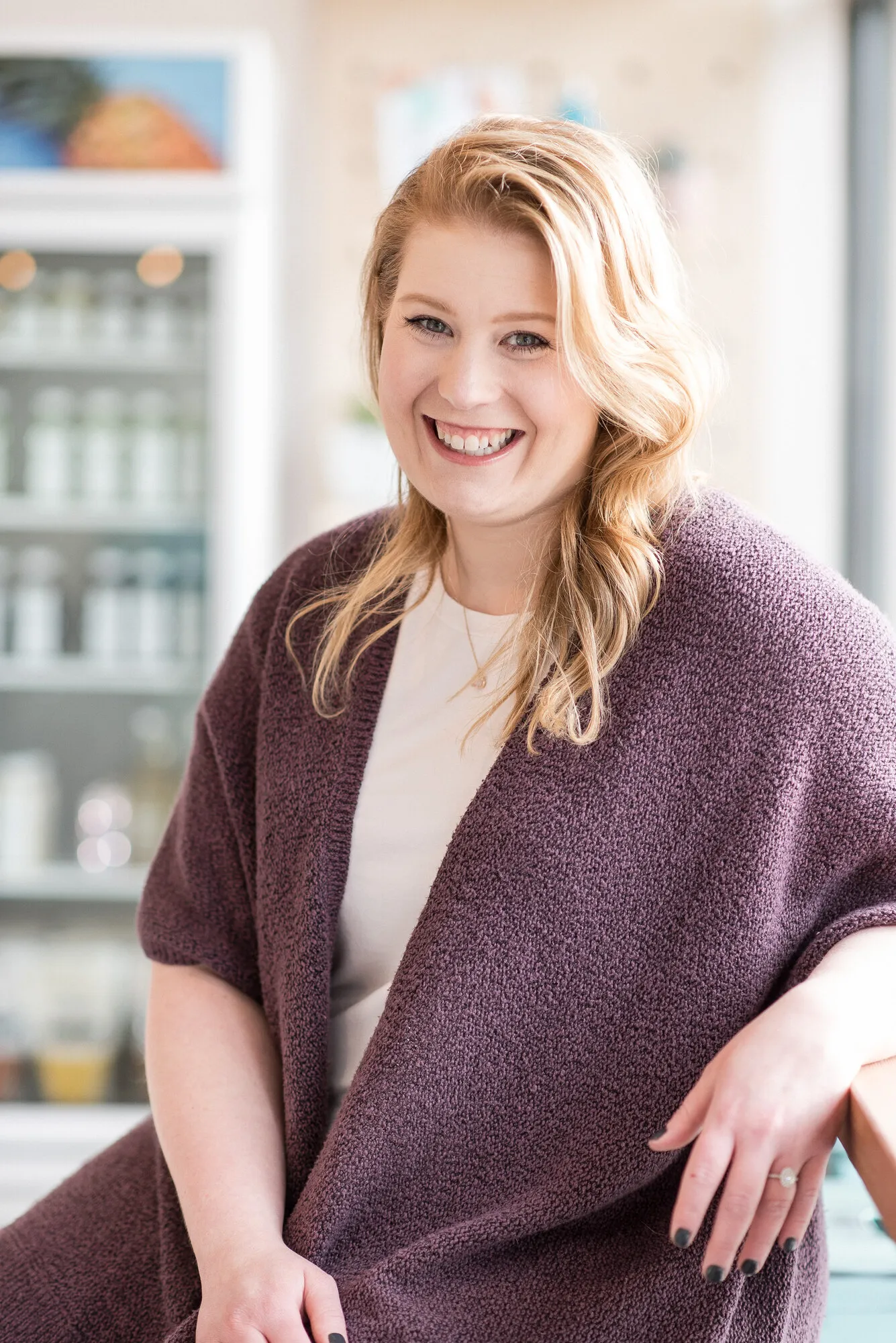 Jessica Morrison in a warm cardigan, smiling.